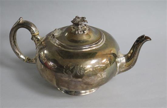 A Victorian silver squat circular teapot, William Robert Smily, London, 1853, gross 19 oz.